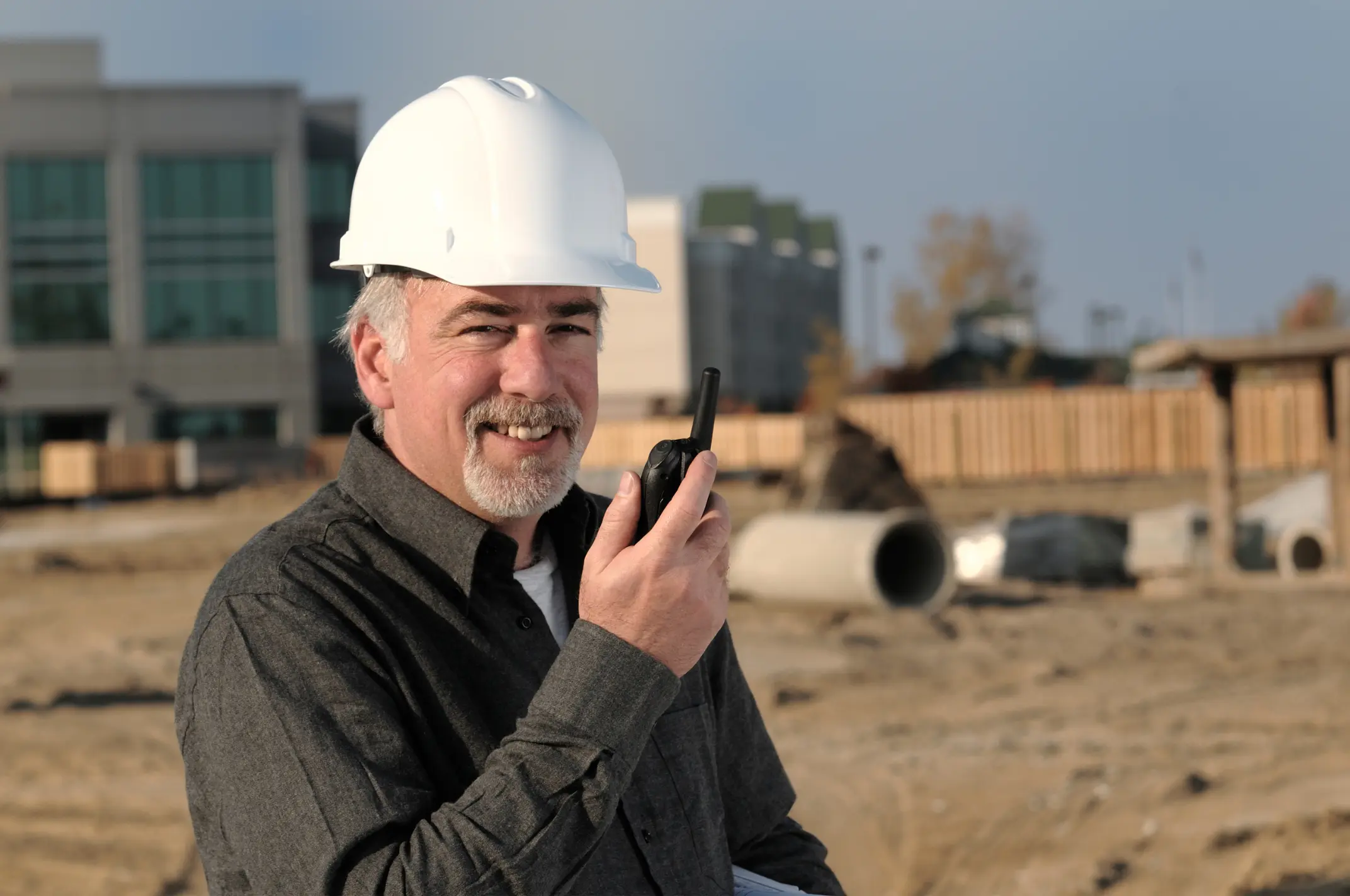 man using a kenwood 2 way radio