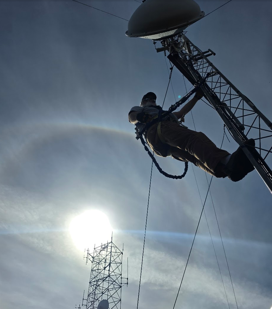 Whisler Communications technician working on a radio tower